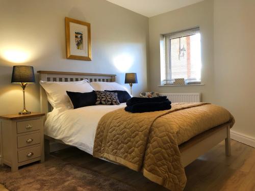 a bedroom with a bed and a window at Lagan View - the perfect location in the city in Belfast