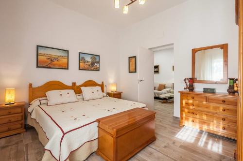 En eller flere senger på et rom på Villa del Manzano