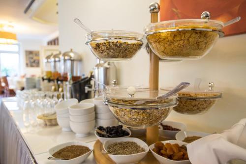 a counter with bowls of food and other ingredients at Hotel Ajana in Ulcinj