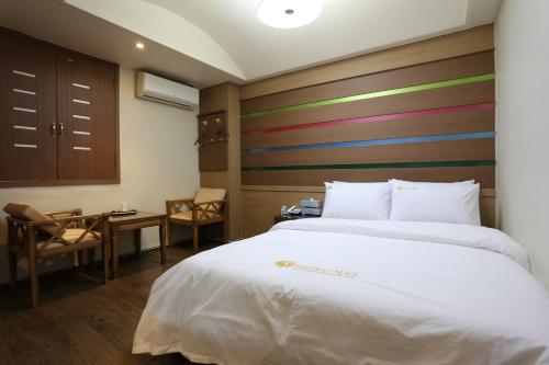 Postel nebo postele na pokoji v ubytování City Park Hotel