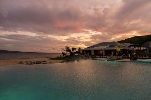 a resort on the beach with a pool of water at Park Hyatt St. Kitts in Christophe Harbour