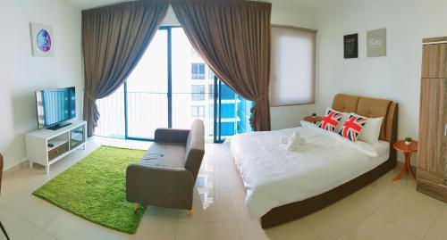 a bedroom with a bed and a chair and a window at Simplicity Cozy For 2 -Trefoil Setia Alam- Near Setia City Mall-Setia Convention Centre in Shah Alam