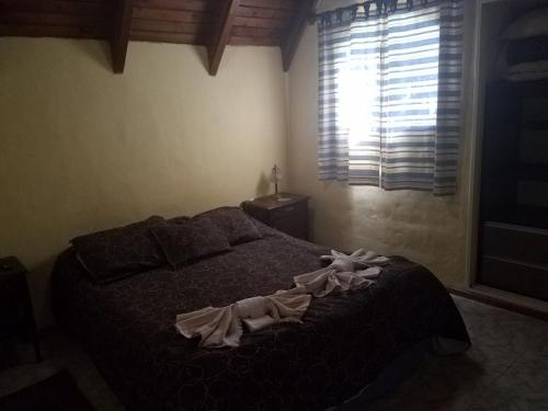 Säng eller sängar i ett rum på Cabañas el Fantasio