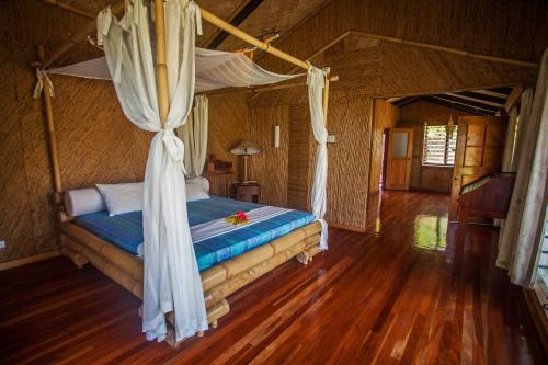 Postel nebo postele na pokoji v ubytování Maravu Taveuni Lodge