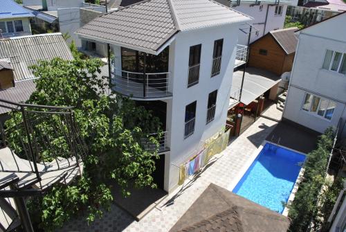 an aerial view of a house and a swimming pool at Comfort in Alushta