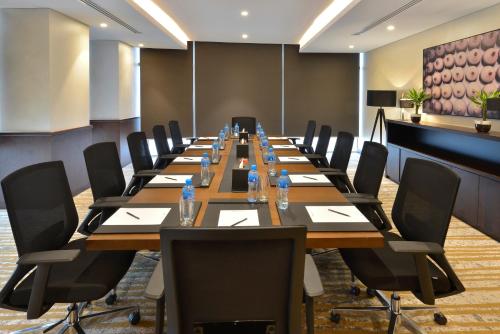 a large conference room with a long table and chairs at Swiss-Belresidences Juffair in Manama