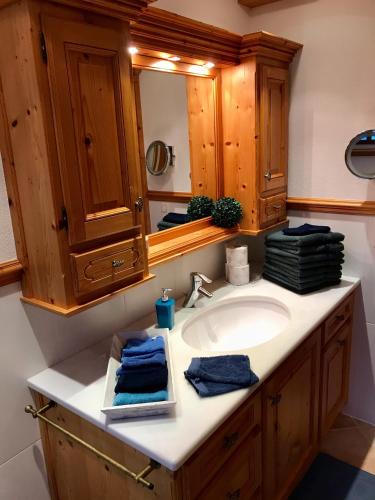 a bathroom with a sink and a mirror at Haus Juna in Schönau am Königssee