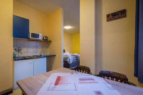 a kitchen with a table with a drawing on it at Miramonti Apartmány in Smokovce