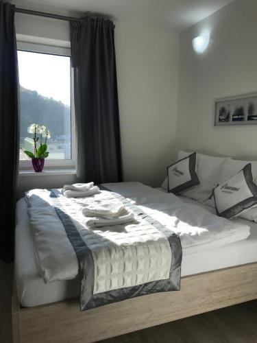 Säng eller sängar i ett rum på Panorama Apartments