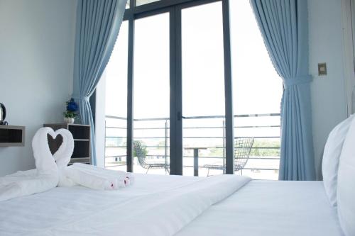 Ein Bett oder Betten in einem Zimmer der Unterkunft Winston Hotel
