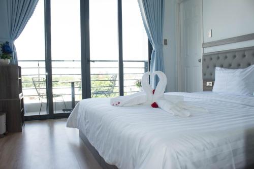 Ein Bett oder Betten in einem Zimmer der Unterkunft Winston Hotel