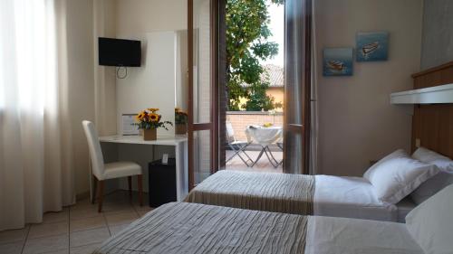 Postel nebo postele na pokoji v ubytování Hotel EMI