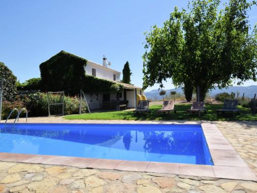 a view of the house and the swimming pool with the villa at Belvilla by OYO Cortijo El Morron in Fuentes de Cesna