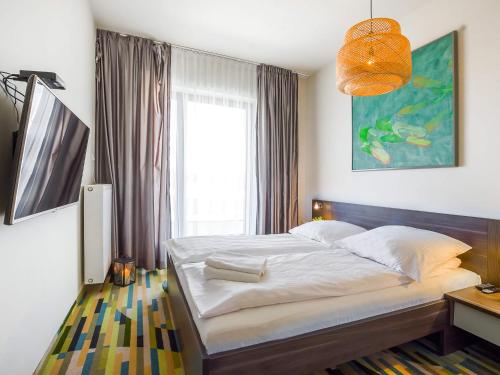 Katil atau katil-katil dalam bilik di VacationClub - Baltic Park Molo Apartament D305