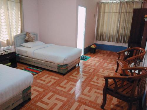 
Letto o letti in una camera di Man Shwe Li Hotel
