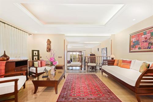 a living room with a bed and a couch and a table at The Marbella Heights Boutique Hotel in Marbella