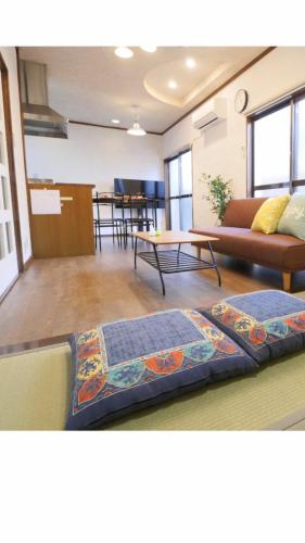 a living room with a couch and a table at west crab base in Hiroshima