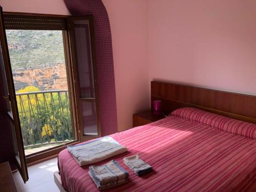 Postel nebo postele na pokoji v ubytování CASA RURAL CASCO ANTIGUO
