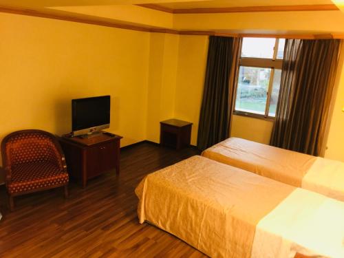 TV a/nebo společenská místnost v ubytování San Ho Business Hotel