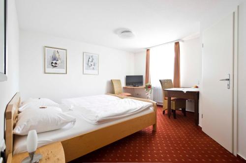 מיטה או מיטות בחדר ב-Landgasthof Lamm