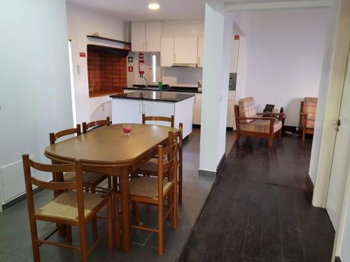 a kitchen and dining room with a table and chairs at Paradise View in Gaula