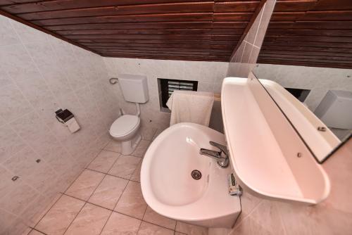 a bathroom with a sink and a toilet at Vacation house Nina in Sukošan