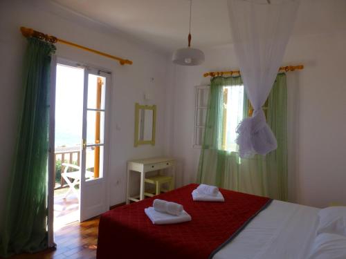 Postel nebo postele na pokoji v ubytování Arokaria Seaside