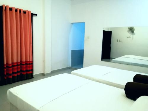 Katil atau katil-katil dalam bilik di Lavendra Villa Mirissa