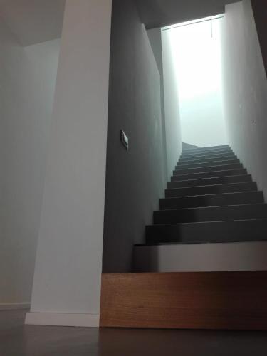 a stairway with a staircase leading up to a window at Patio 101 "Exclusive" in San Vito lo Capo