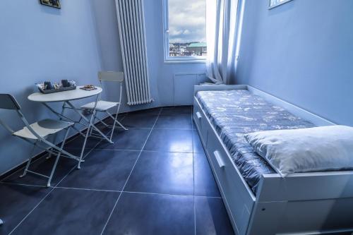 Katil atau katil-katil dalam bilik di Il Grattacielo b&b
