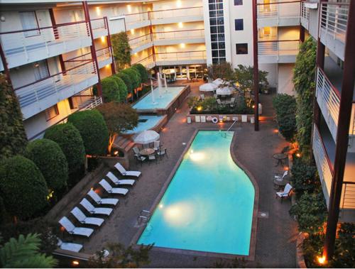 an overhead view of a swimming pool in a building at Cupertino Hotel in Cupertino