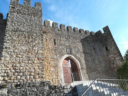 an old castle with a large brick wall at Irís Apartment in Pombal