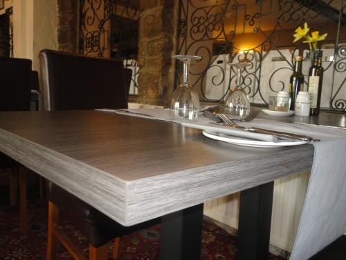 a table with a table cloth on top of it at The Dog & Partridge Country Inn in Ashbourne