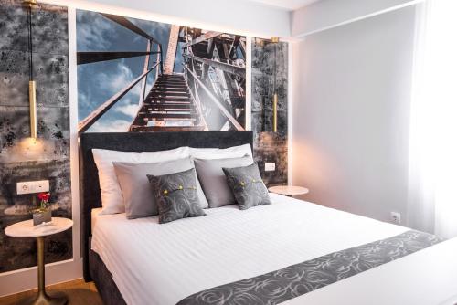 a bedroom with a bed with a staircase in the background at La Loggia in Labin