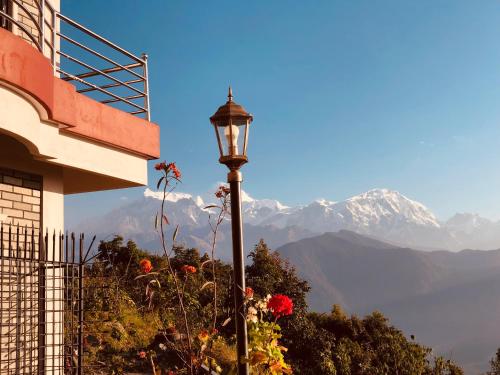 a street light with a view of a mountain at Hotel Pristine Himalaya in Pokhara