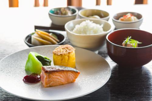 a plate of food with sushi and rice on a table at NIPPONIA HOTEL NARA NARAMACHI in Nara