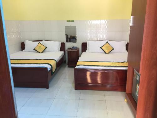 a hotel room with two beds at Tan My Thien Hotel in Tây Ninh