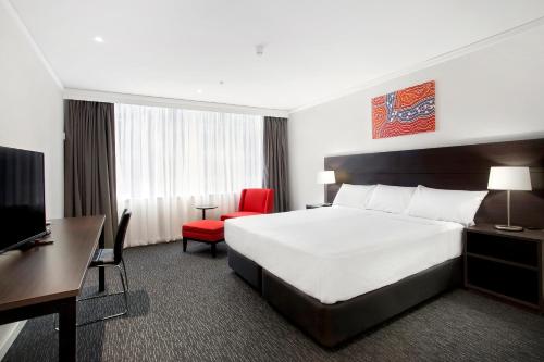 Un pat sau paturi într-o cameră la Bayview Eden Melbourne