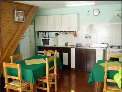 A kitchen or kitchenette at Residencial Sissus