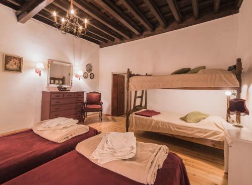 a room with two bunk beds and a mirror at Kristina´s rooms in Rhodes Town