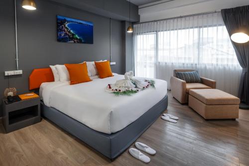 Postel nebo postele na pokoji v ubytování 7 Days Premium Hotel Pattaya