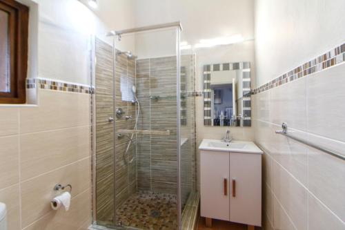 a bathroom with a shower and a sink at Lot 25 SM06 in Southbroom