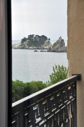 a view of the ocean from a balcony at Seaside Apartments Petrovac in Petrovac na Moru