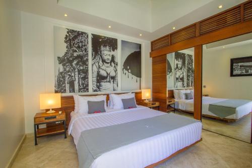 a large bedroom with two beds and two lamps at Vishuddha Ajna Villa - Outstanding 2 bdr villa - GREAT LOCATION! in Seminyak