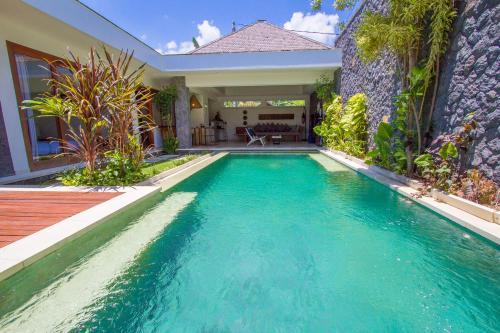 a swimming pool in the backyard of a house at Vishuddha Ajna Villa - Outstanding 2 bdr villa - GREAT LOCATION! in Seminyak