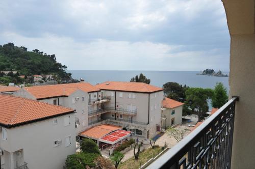 a view from a balcony of a building and the water at Seaside Apartments Petrovac in Petrovac na Moru