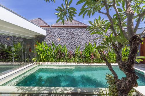 a swimming pool in front of a villa at Vishuddha Ajna Villa - Outstanding 2 bdr villa - GREAT LOCATION! in Seminyak