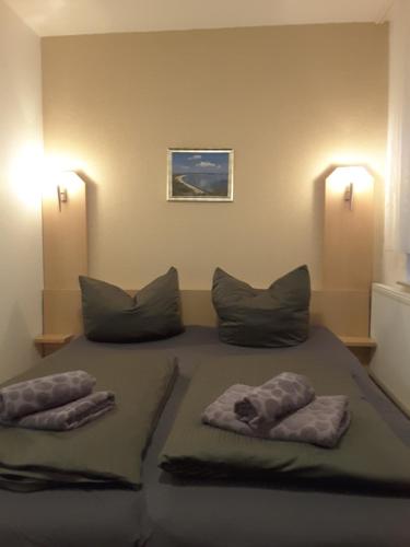 Ein Bett oder Betten in einem Zimmer der Unterkunft Strandidyll