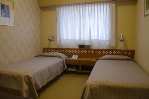 Ένα ή περισσότερα κρεβάτια σε δωμάτιο στο Hostal Santa Fe De La Veracruz