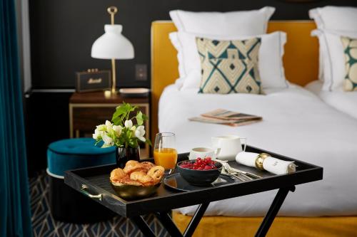 En eller flere senge i et værelse på Le Roch Hotel & Spa